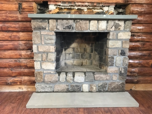 Cut granite and bluestone fireplace