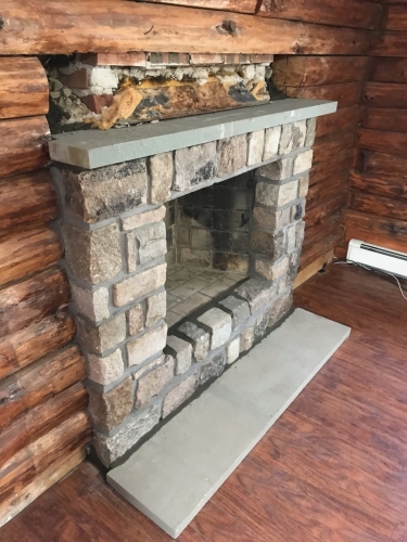 Cut granite and bluestone fireplace