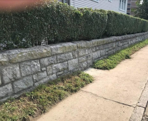 Repointed cut granite wall