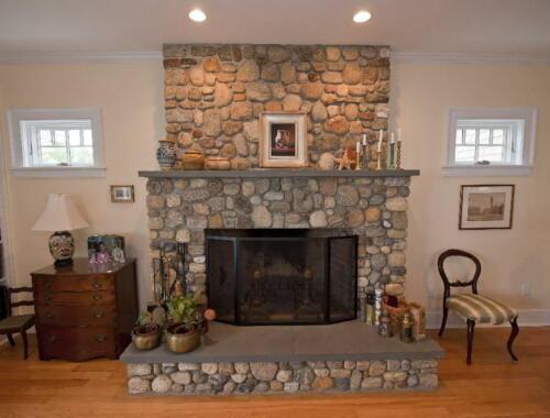 Round fieldstone -- hand picked (not thinstone) Fireplace