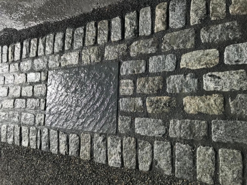 Cobblestone driveway apron laid in cement