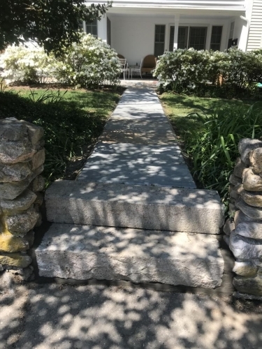 Cement walkway and cut granite steps