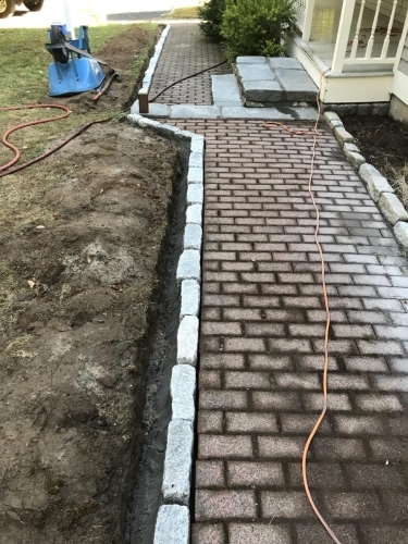 Brick walkway with cobblestone edging