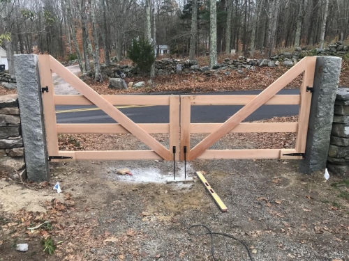 Antique stone post installation with gate