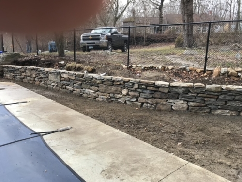 Low fieldstone retaining walls 