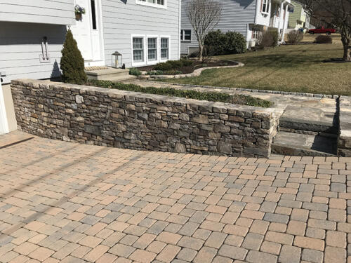 Fieldstone Retaining Wall and Planter With Steps