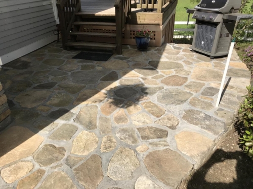 Field stone patio and steps capped with granite