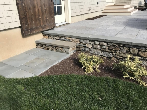 Bluestone patio and steps with field stone edging