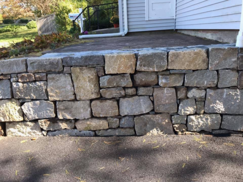 Antique Cut Granite Retaining Wall