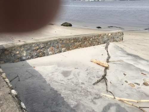 rebuilt stone wall after a hurricane